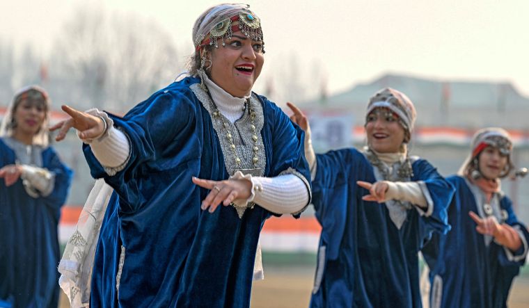 Dancers wear a traditional Kashmiri dress as they take part in a full dress rehearsal for the upcoming Republic Day parade at Bakshi Stadium in Srinagar on January 24, 2024